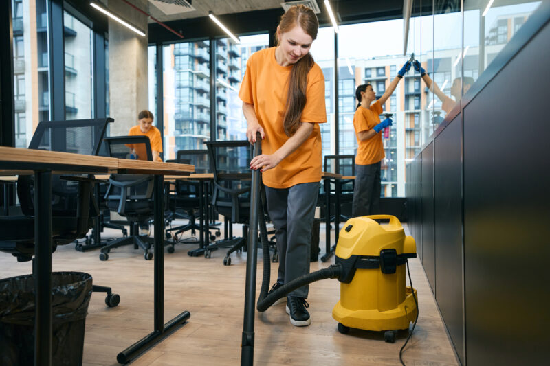 female cleaning company team in overalls cleans an 2022 11 23 06 19 39 utc